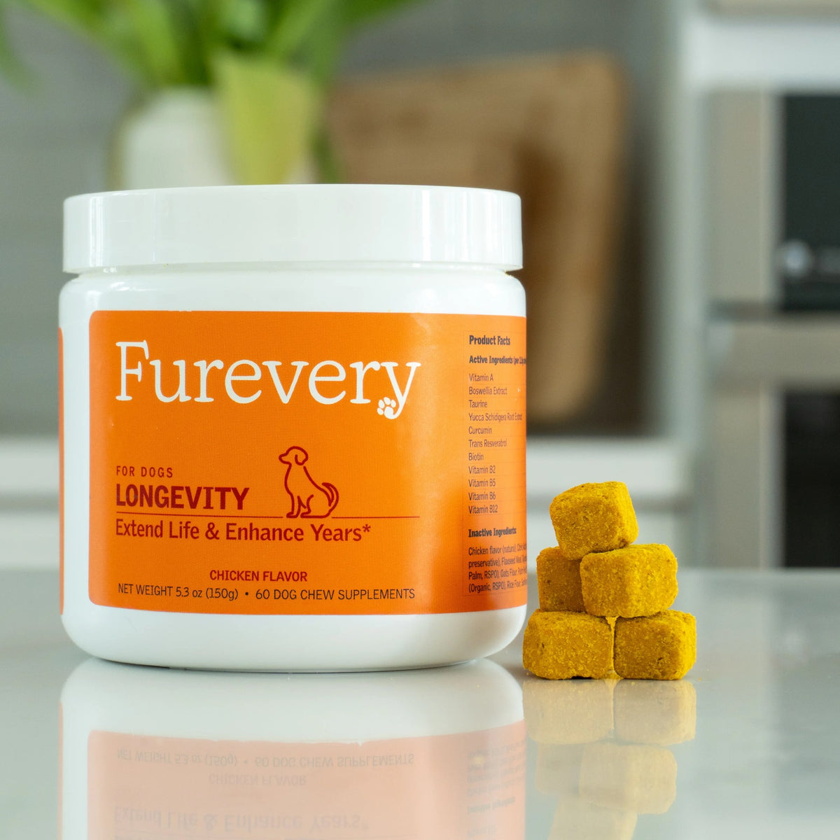 Furevery Longevity chicken-flavor chews jar on a kitchen counter with a stack of soft chews